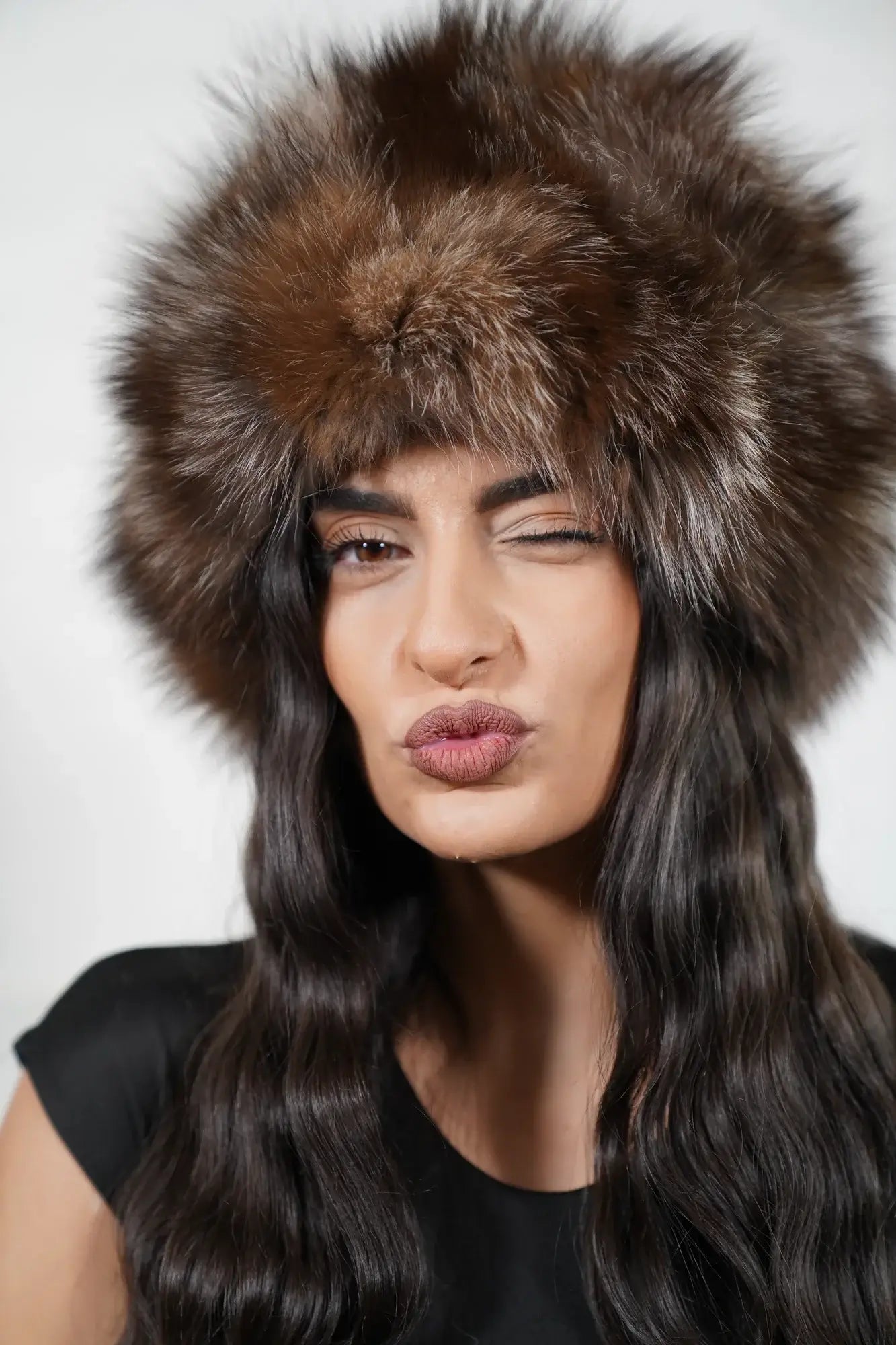Fox fur hat natural crystal worn showing full voluminous round natural crystal fox fur silhouette and brown silver variation from front — Greek craftsmanship, TatiFurs
