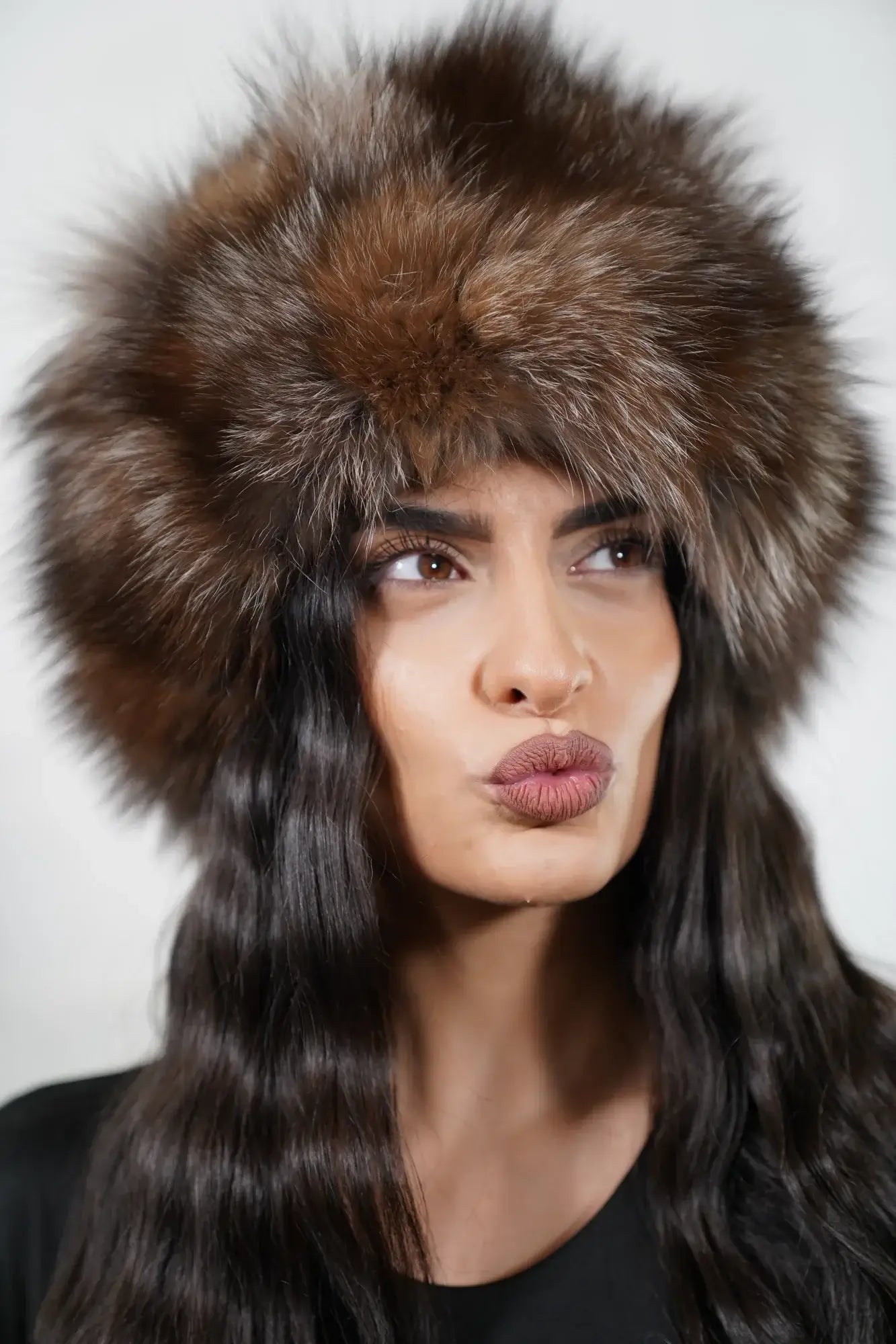 Fox fur hat natural crystal shown from the side displaying full voluminous round silhouette and natural brown silver crystal fox pile depth — Greek craftsmanship, TatiFurs
