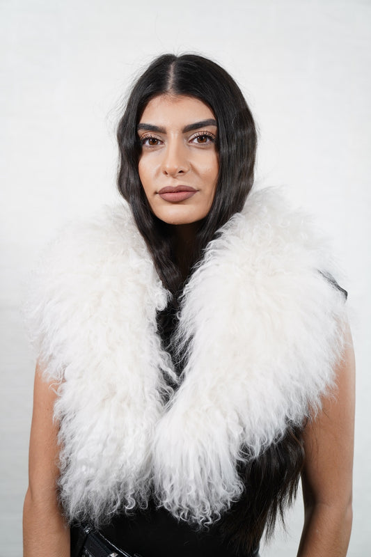 Mongolian Sheepskin Collar White — Curly Lamb Fur worn by a woman, front view of the long curly pure snow white Tibetan lamb fur framing the face and shoulders, TatiFurs