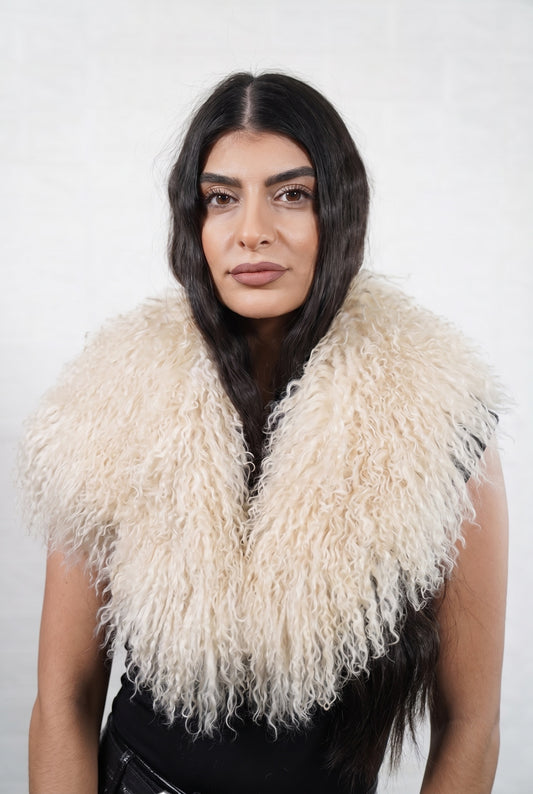 Mongolian Sheepskin Collar Cream — Curly Lamb Fur worn by a woman, front view of the long curly soft cream ivory Tibetan lamb fur framing the face and shoulders, TatiFurs