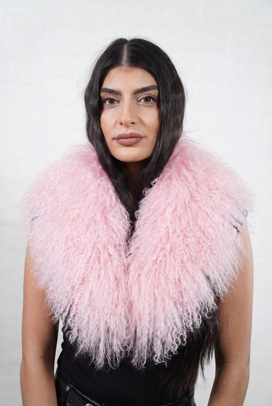 Mongolian Sheepskin Collar Pink — Curly Lamb Fur worn by a woman, front view of the long curly pale powder pink Tibetan lamb fur framing the face and shoulders, TatiFurs