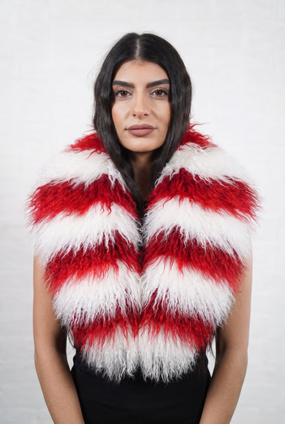 Mongolian Sheepskin Collar Red White — Curly Lamb Fur, Xmas Edition worn by a woman, front view of the long curly candy-cane red and white striped Tibetan lamb fur framing the face and shoulders, TatiFurs