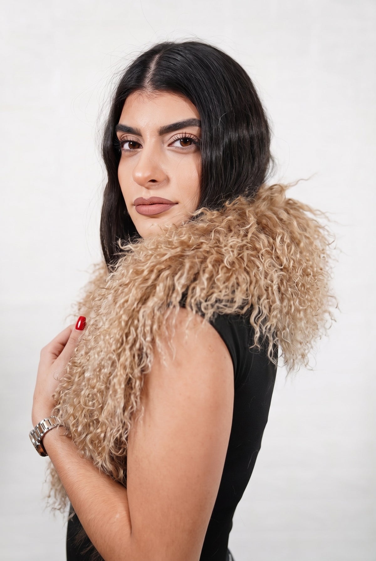 Mongolian Sheepskin Collar Light Brown — Curly Lamb Fur three-quarter view over the shoulder, volume of the milky caramel light brown Mongolian lamb curls around the neck — handmade in Greece, TatiFurs