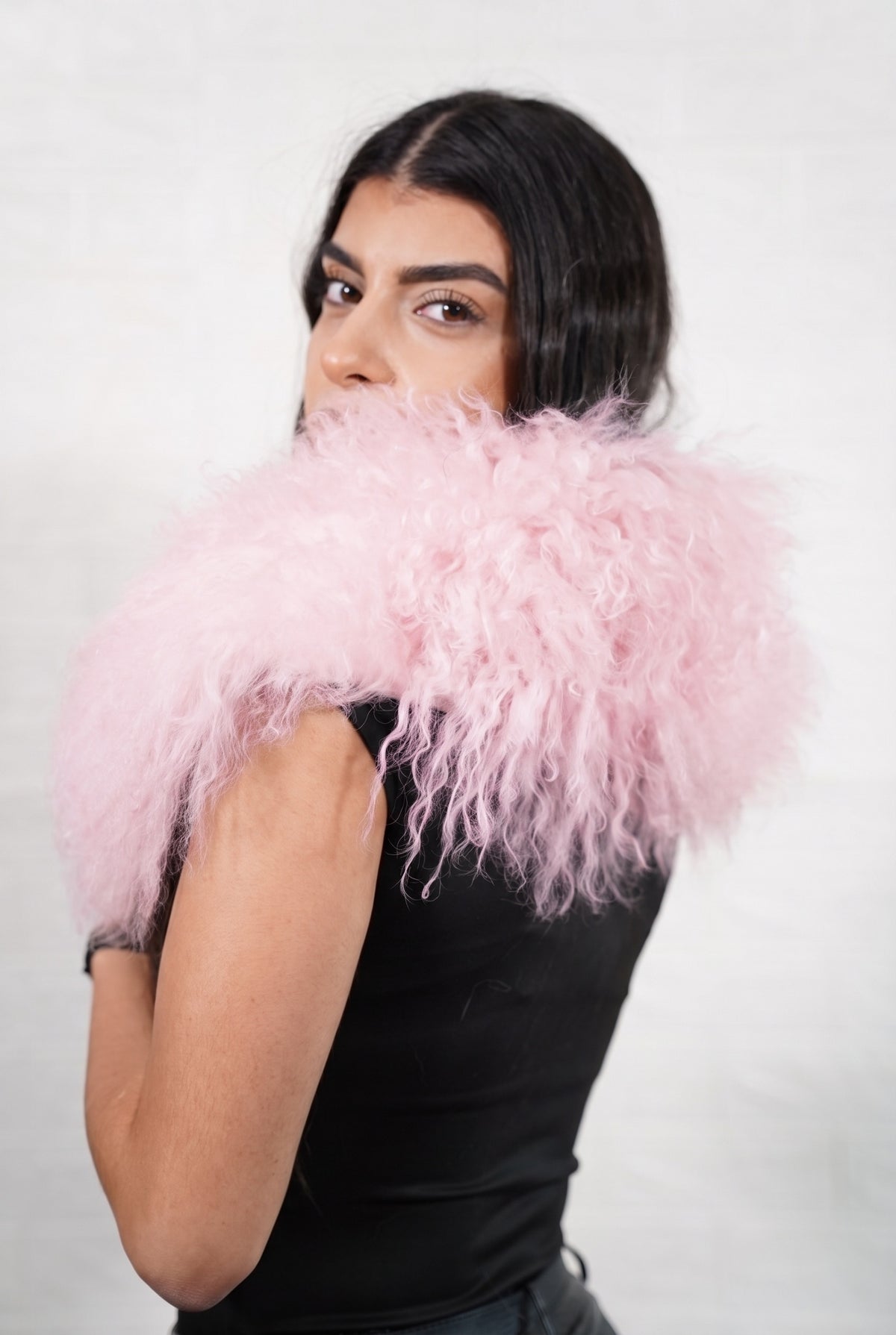 Mongolian Sheepskin Collar Pink — Curly Lamb Fur seen from behind, pale powder pink curly sheepskin wrapped high around the neck and shoulders — TatiFurs