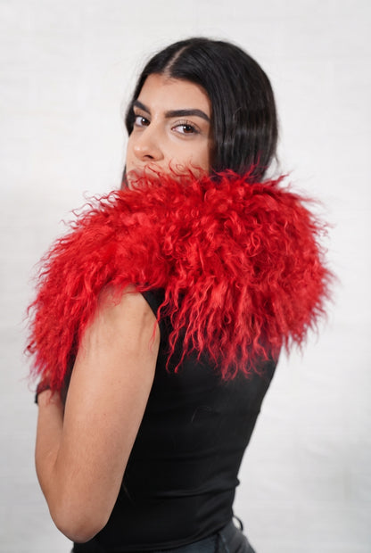 Mongolian Sheepskin Collar Red — Curly Lamb Fur seen from behind, vivid scarlet red curly sheepskin wrapped high around the neck and shoulders — TatiFurs