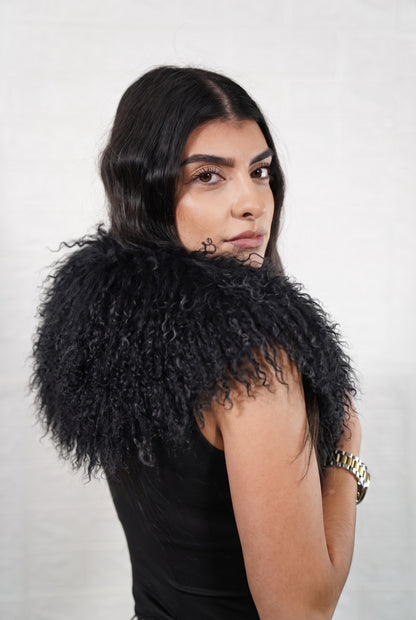 Mongolian Sheepskin Collar Black — Curly Lamb Fur side view showing the length of the deep jet black Mongolian sheepskin collar over the shoulder — Greek craftsmanship, TatiFurs