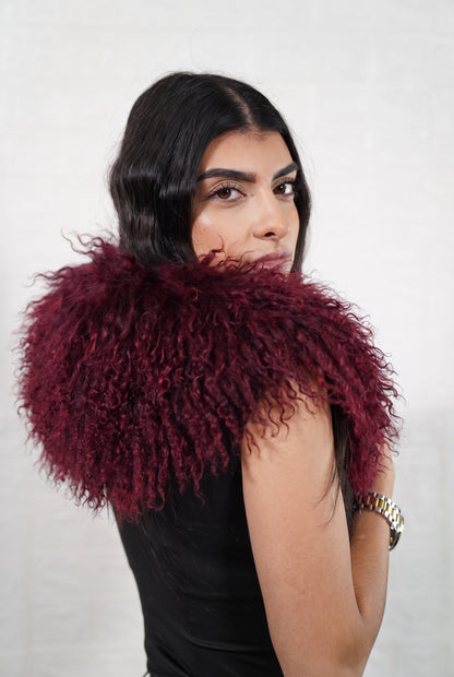 Mongolian Sheepskin Collar Burgundy — Curly Lamb Fur side view showing the length of the deep oxblood burgundy Mongolian sheepskin collar over the shoulder — Greek craftsmanship, TatiFurs