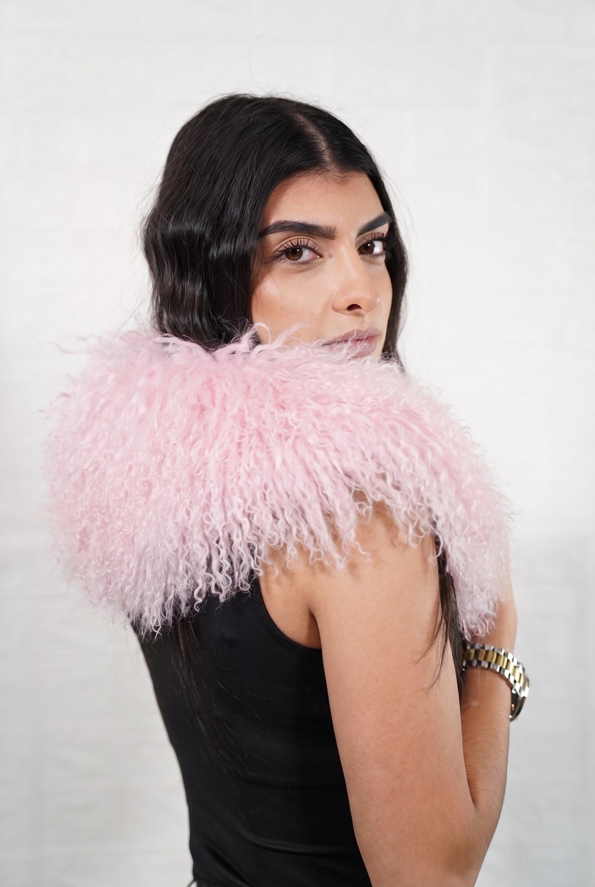 Mongolian Sheepskin Collar Pink — Curly Lamb Fur side view showing the length of the pale powder pink Mongolian sheepskin collar over the shoulder — Greek craftsmanship, TatiFurs