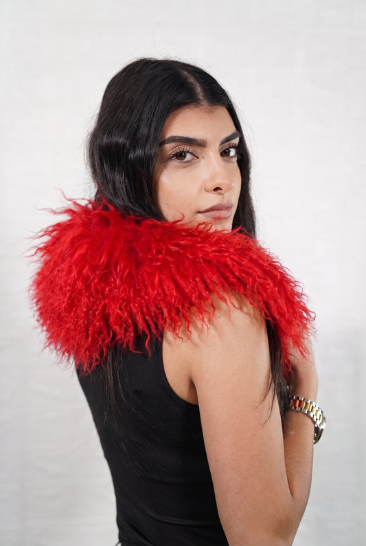 Mongolian Sheepskin Collar Red — Curly Lamb Fur side view showing the length of the vivid scarlet red Mongolian sheepskin collar over the shoulder — Greek craftsmanship, TatiFurs