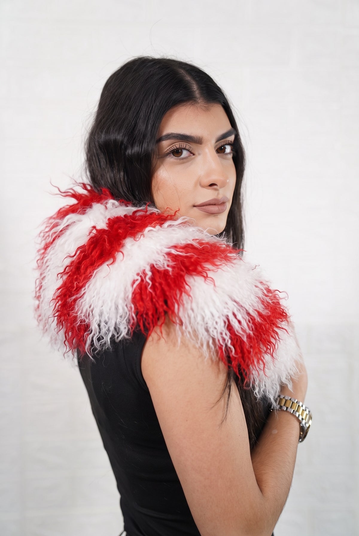 Mongolian Sheepskin Collar Red White — Curly Lamb Fur, Xmas Edition side view showing the length of the candy-cane red and white striped Mongolian sheepskin collar over the shoulder — Greek craftsmanship, TatiFurs