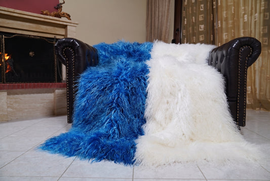Mongolian Blanket Throw Blue White Two Tone — Wool Sheepskin spread across the leather sofa showing the whole cobalt blue and pure white Mongolian wool surface — Greek craftsmanship, TatiFurs