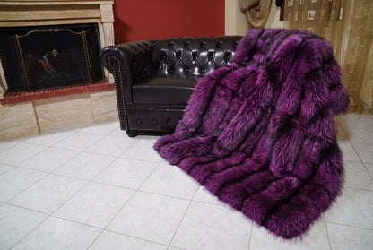 Fox Fur Blanket Throw Purple Silver — Full Skin Saga Furs spilling from the armchair onto the tiled floor — the purple-tipped silver full skin fox fur catching the light, TatiFurs