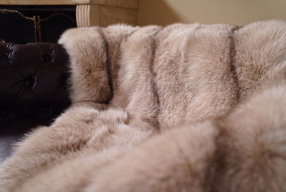 Fox Fur Blanket Throw Palomino Frost — Full Skin Saga Furs close-up of the dense sand and brown Palomino Frost fox fur texture at the edge of the armchair — Saga Furs quality, TatiFurs