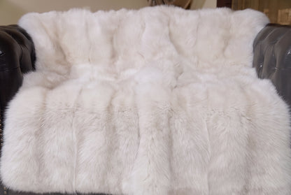 Fox Fur Blanket Throw Pearl Frost — Full Skin Saga Furs close-up of the dense pearl ivory with a soft champagne glow fox fur texture at the edge of the armchair — Saga Furs quality, TatiFurs