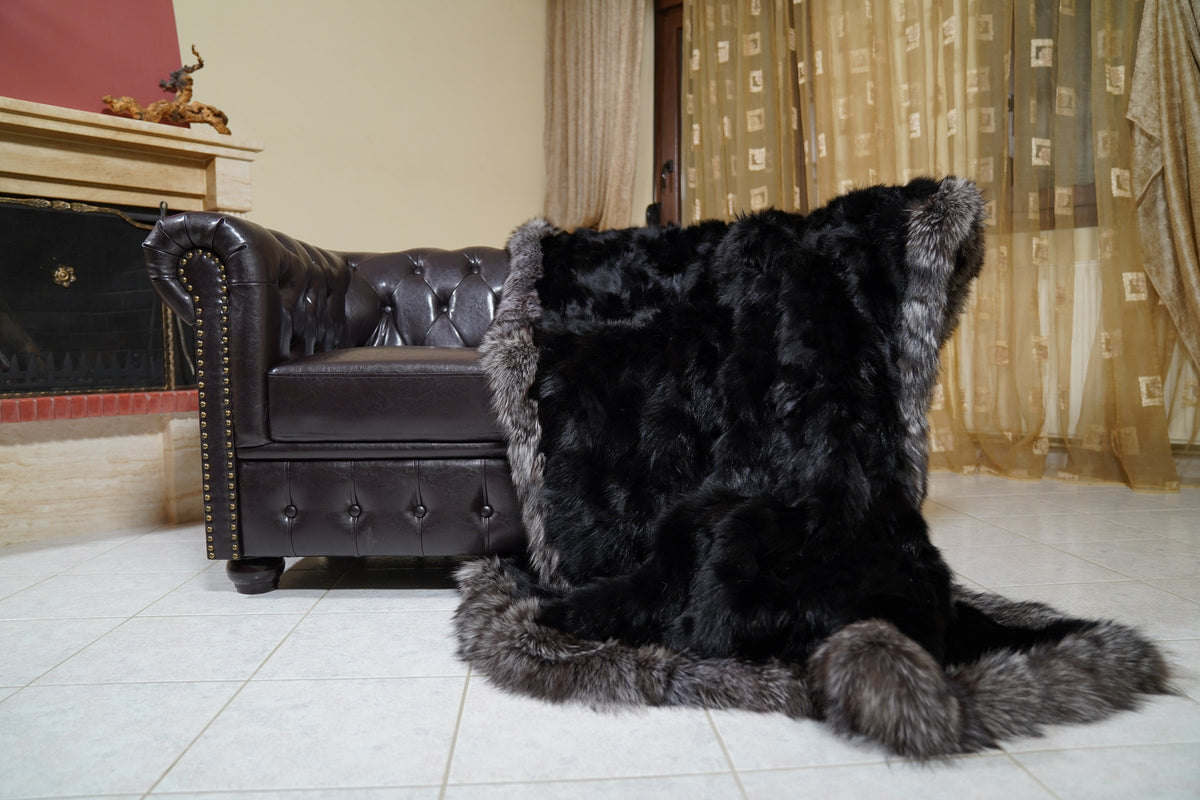 fox fur blanket throw black silver borders — hanging from the sofa arm showing the black fox panels and silver fox border — TatiFurs