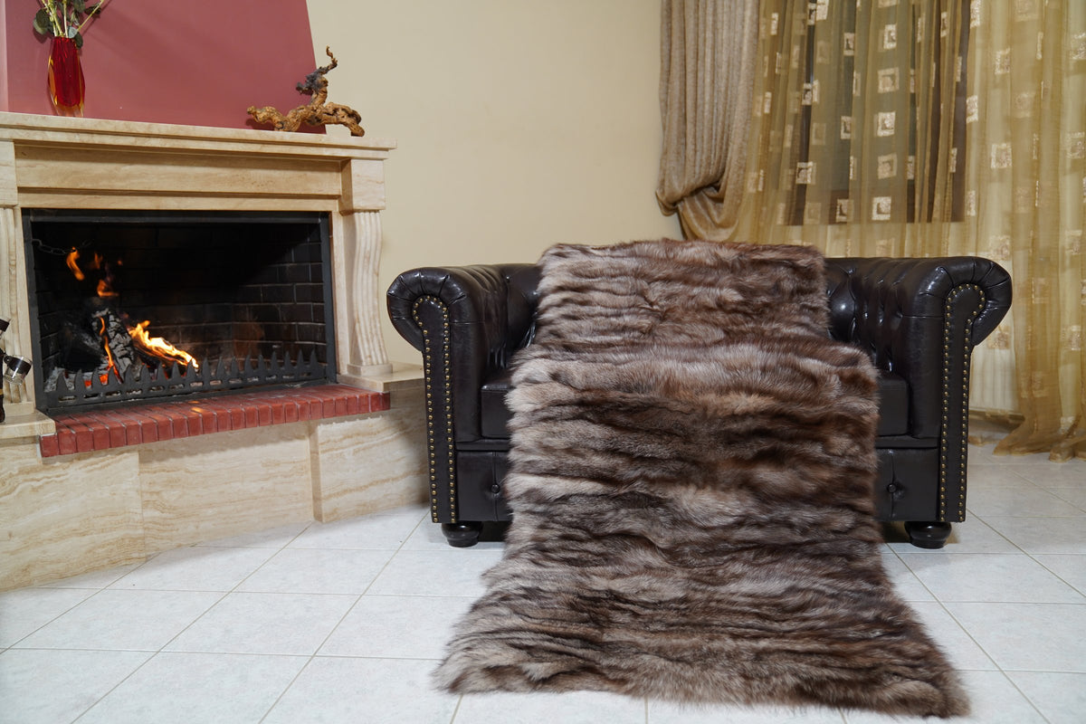 fox fur blanket throw crystal natural striped — laid over the leather armchair by the fireplace, brown crystal fox rows with silver tips — TatiFurs