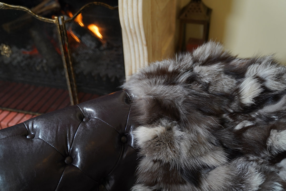 fox fur blanket throw frost natural — close-up of the natural frost fox fur over the sofa arm — TatiFurs