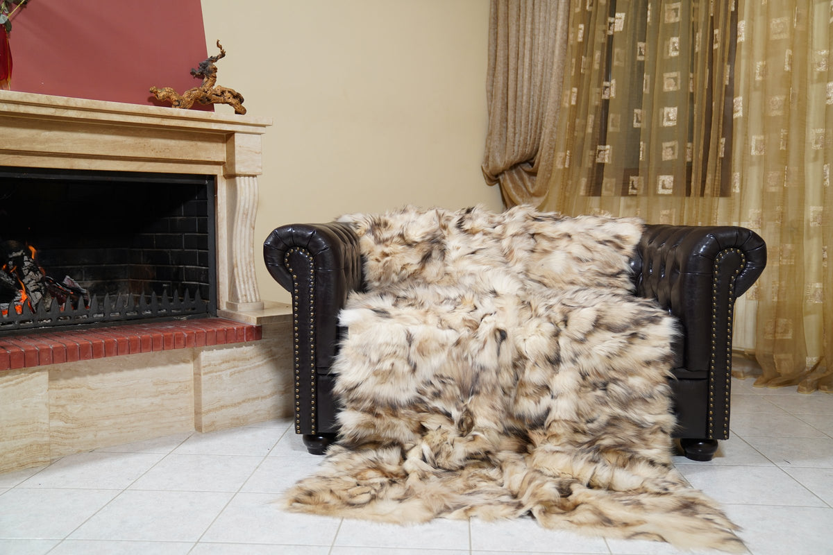 fox fur blanket throw iceberg beige natural — draped over the Chesterfield sofa, cream and beige fox panels with brown markings — TatiFurs