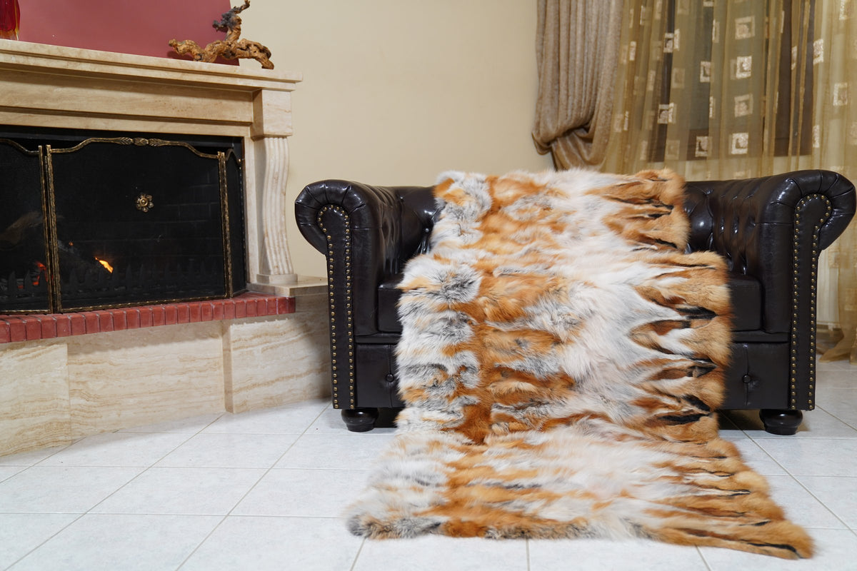 fox fur blanket throw double sided red canadian striped — laid over the leather armchair, red Canadian fox rows with white bands — TatiFurs
