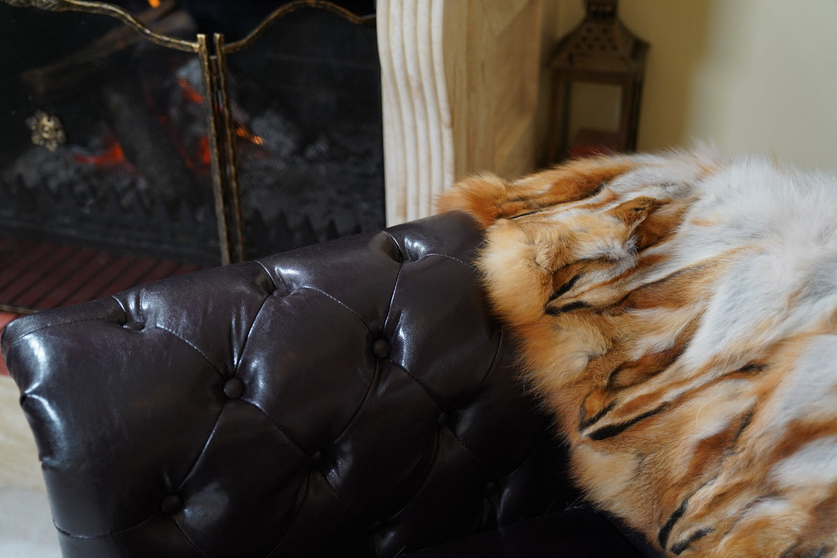 fox fur blanket throw red canadian striped — close-up of the natural red Canadian fox with white and black markings by the fireplace — TatiFurs