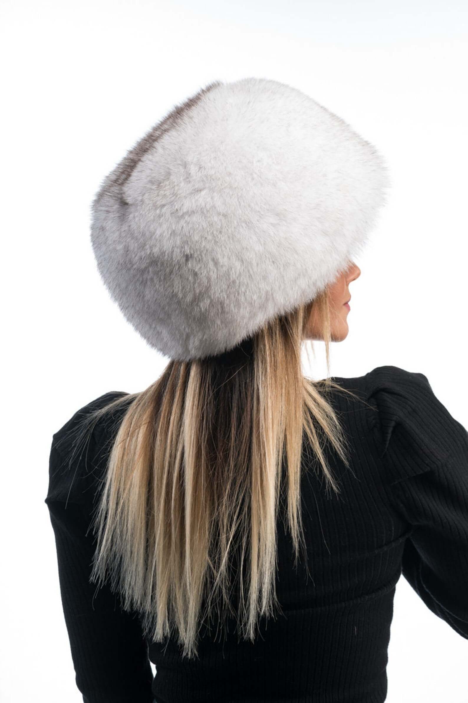Fox Fur Hat Natural Blue - Tatifurs worn by a woman, showcasing the luxurious fur texture from the back.