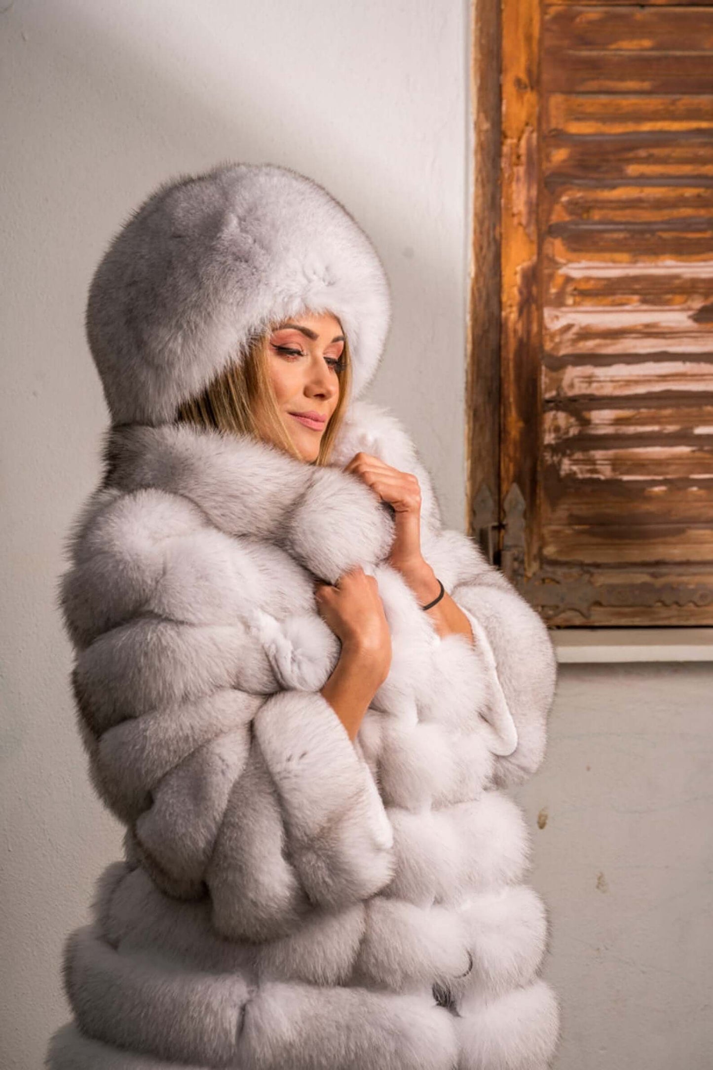 Fox Fur Hat Natural Blue - Tatifurs worn with matching fur coat, showcasing luxurious softness and elegance.