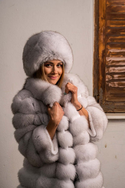 Fox Fur Hat Natural Blue - Tatifurs worn by a smiling woman with a stylish fur coat.