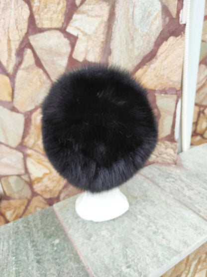 Fox Fur Hat Black - Tatifurs displayed on a stand, showcasing its rich black fur texture.