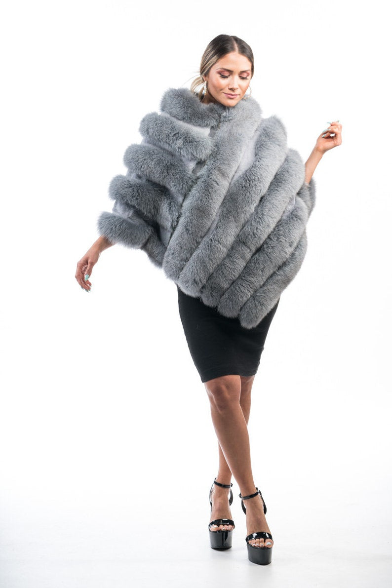 Fox fur poncho gray close-up texture showing full skin gray fox long pile and diagonal strip construction across poncho surface — Greek craftsmanship, TatiFurs
