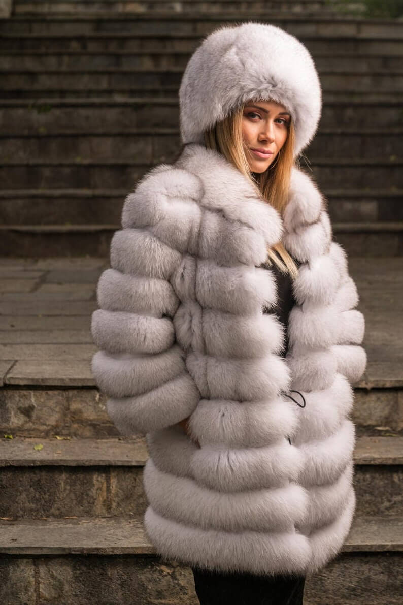 Fox fur coat blue natural displaying full skin natural blue fox horizontal rows with rabbit fur trim strips and above knee silhouette — Greek craftsmanship, TatiFurs
