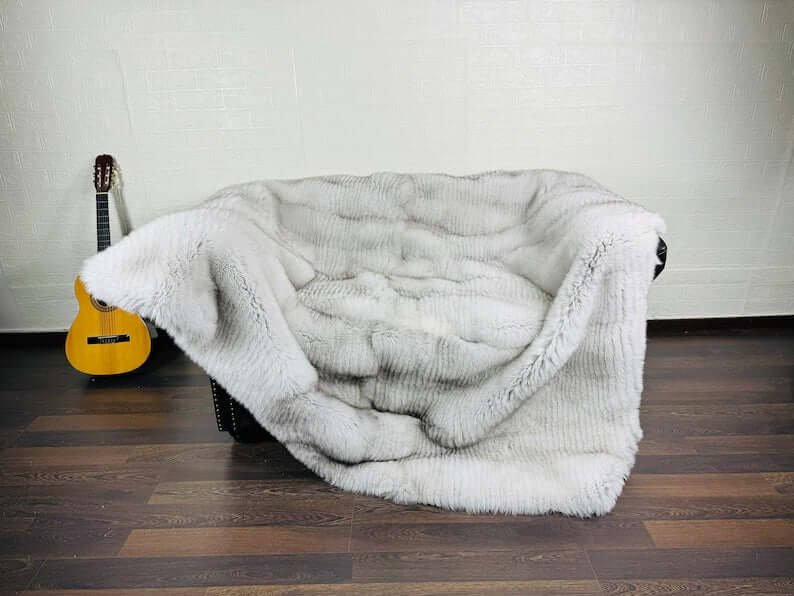 Detail shot of natural blue fox fur full skin blanket showing cool blue to silver tonal gradation
