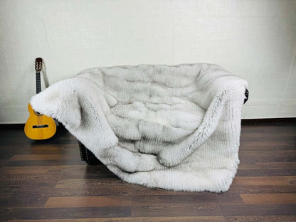 Detail shot of natural blue fox fur full skin blanket showing cool blue to silver tonal gradation
