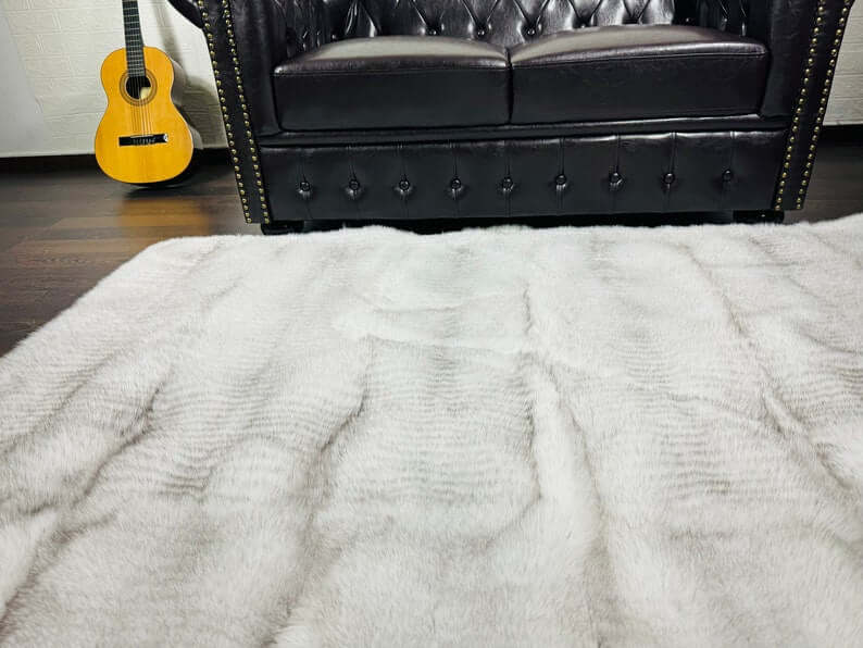 Close-up of natural blue fox fur full skin blanket texture showing natural pelt silhouette and cool depth
