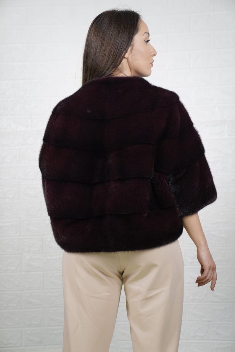Woman wearing burgundy mink fur bomber jacket full skin – luxury Greek craftsmanship
