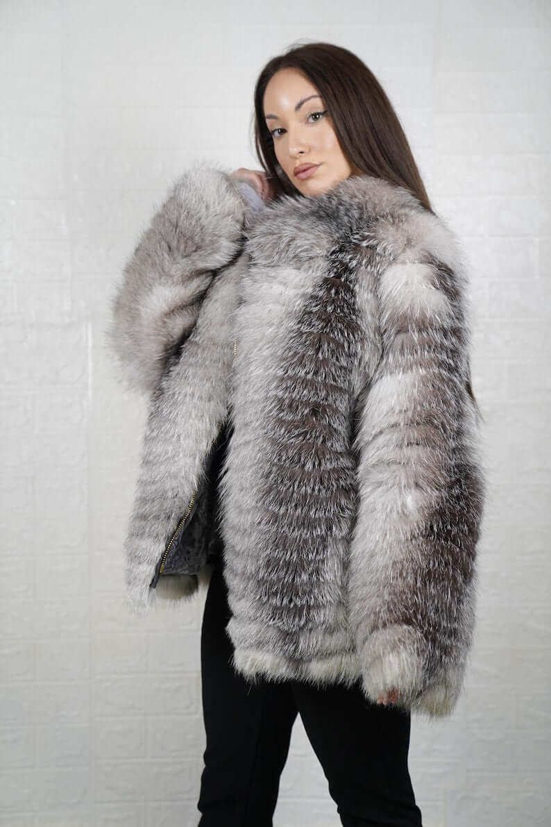 Side profile of mid-length frost fox fur coat showing silhouette and collar
