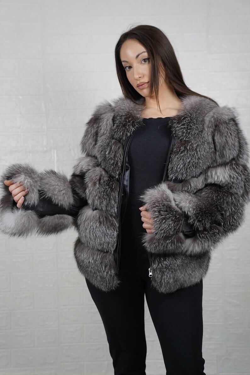 Model adjusting the collar of the frost fox fur bomber jacket
