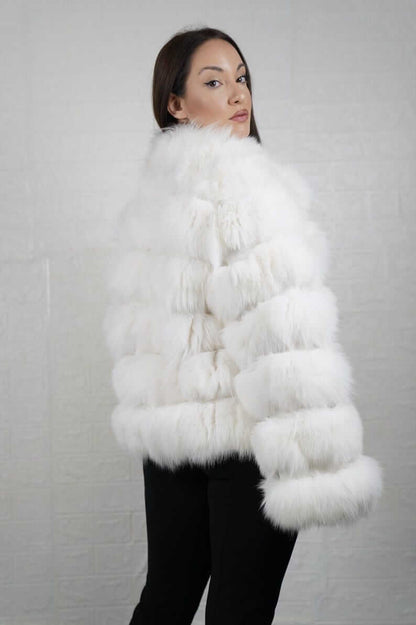 Side profile of white fox fur short jacket showing silhouette and collar
