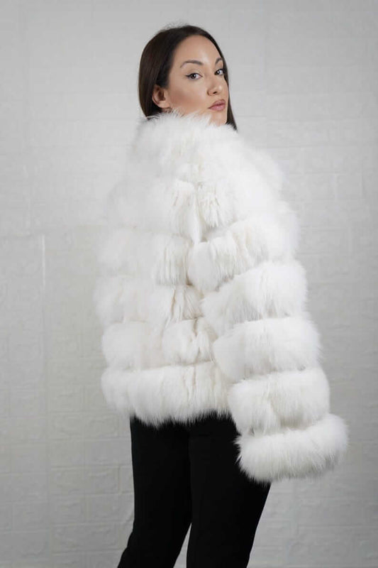 Side profile of white fox fur short jacket showing silhouette and collar
