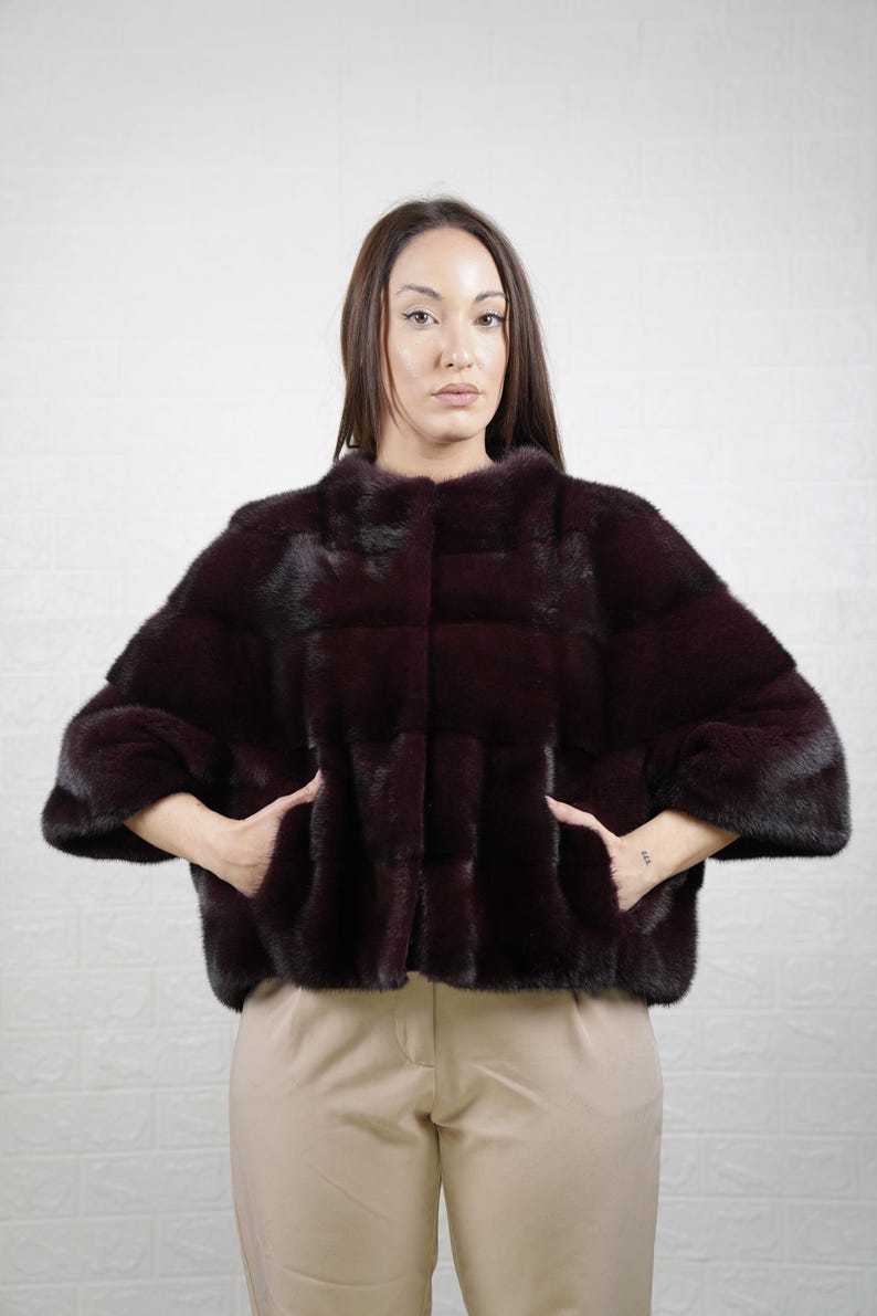 Close-up of real burgundy mink fur full skin for premium quality and softness

