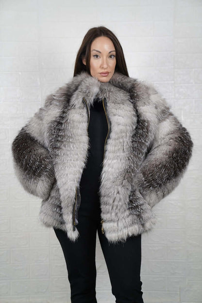 Woman wearing frost fox fur full skin coat with zipper closure and collar
