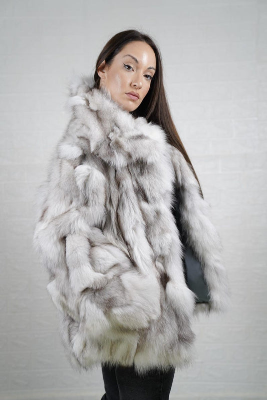 Model wearing natural blue fox fur coat jacket with collar, styled for winter
