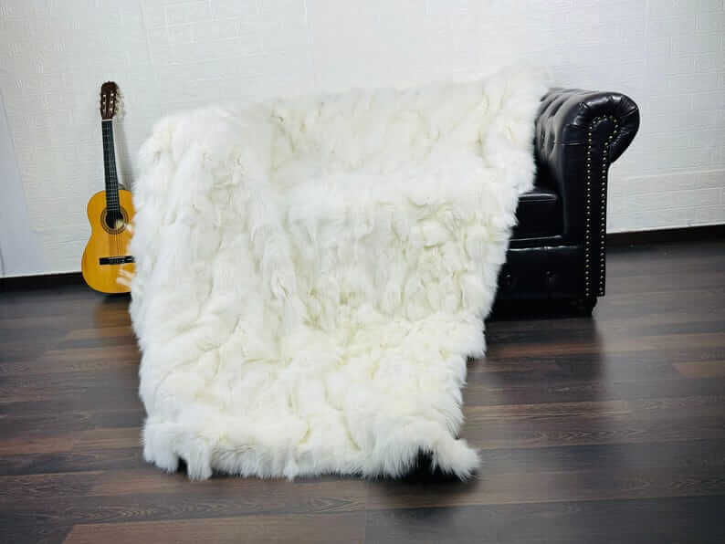 Fox fur blanket throw white laid flat showing full size and consistently luminous white fox fur from edge to edge
