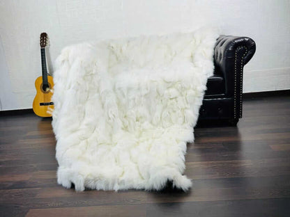 Fox fur blanket throw white laid flat showing full size and consistently luminous white fox fur from edge to edge

