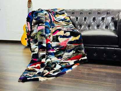 rex rabbit fur throw blanket multicolor — draped across white sofa, vivid colour against clean base — Greek craftsmanship, TatiFurs
