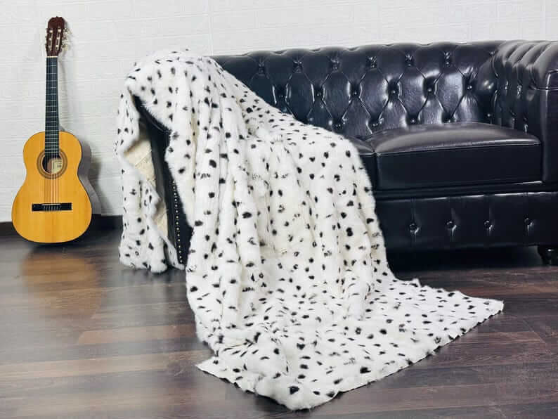 rabbit fur throw blanket dalmatian print — pure white ground, bold irregular black spots, graphic surface — Greek craftsmanship, TatiFurs
