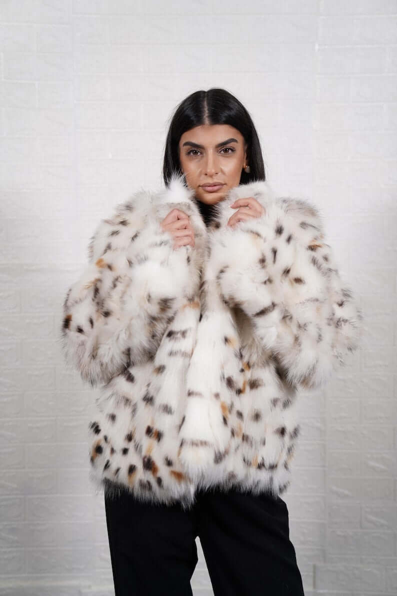 White fox fur coat styled for a luxury winter evening look
