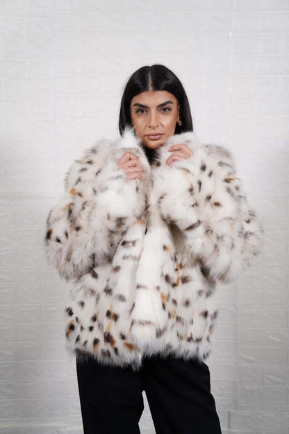 White fox fur coat styled for a luxury winter evening look
