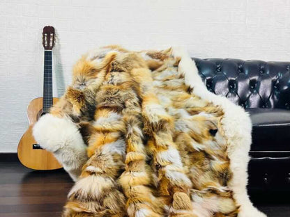 fox fur throw blanket red canadian — draped across dark sofa, natural red fox against dark base — Greek craftsmanship, TatiFurs
