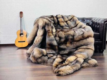 Natural Crystal Fox Fur Blanket - Tatifurs draped on a sofa, showcasing its warm, earthy tones and luxurious texture.