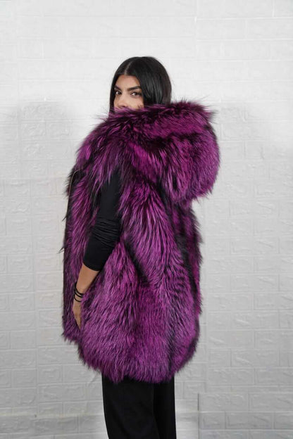 Side profile of hooded fox fur vest showing mid-length silhouette and zipper

